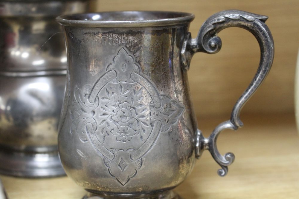 A Victorian silver plated chamberstick, pewter tankards, plates and a toast rack